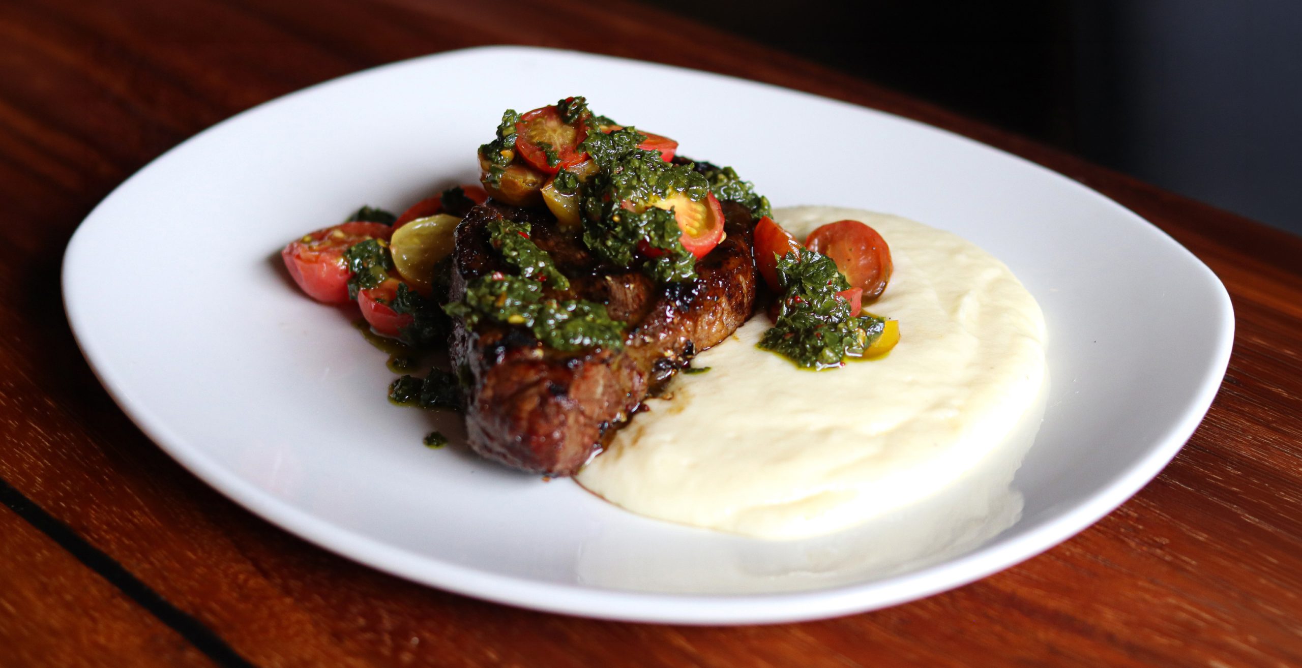 White plate with Southern cuisine at a restaurant.